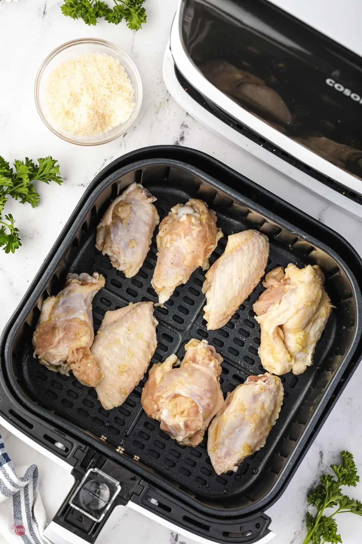 wings in an air fryer basket