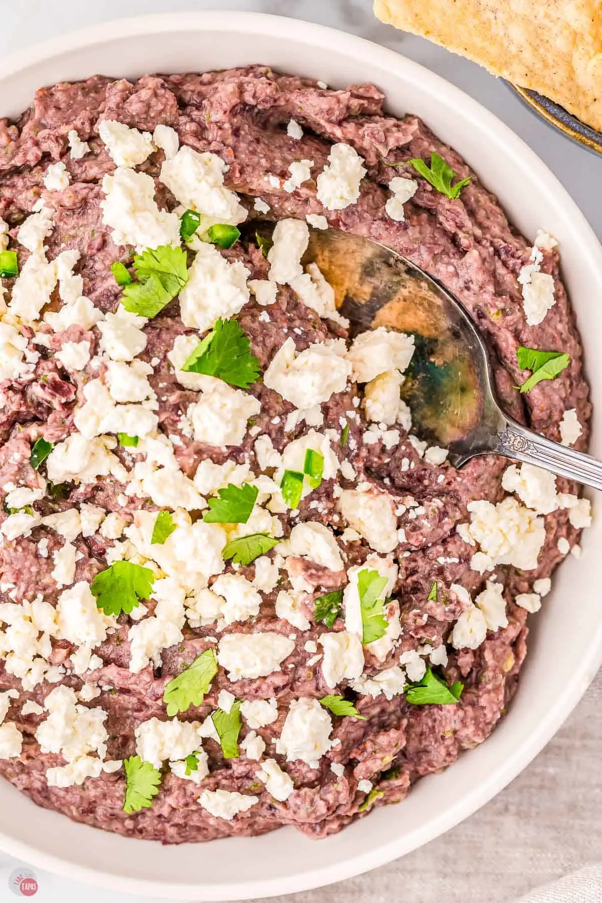 bowl of black bean dip with a spoon