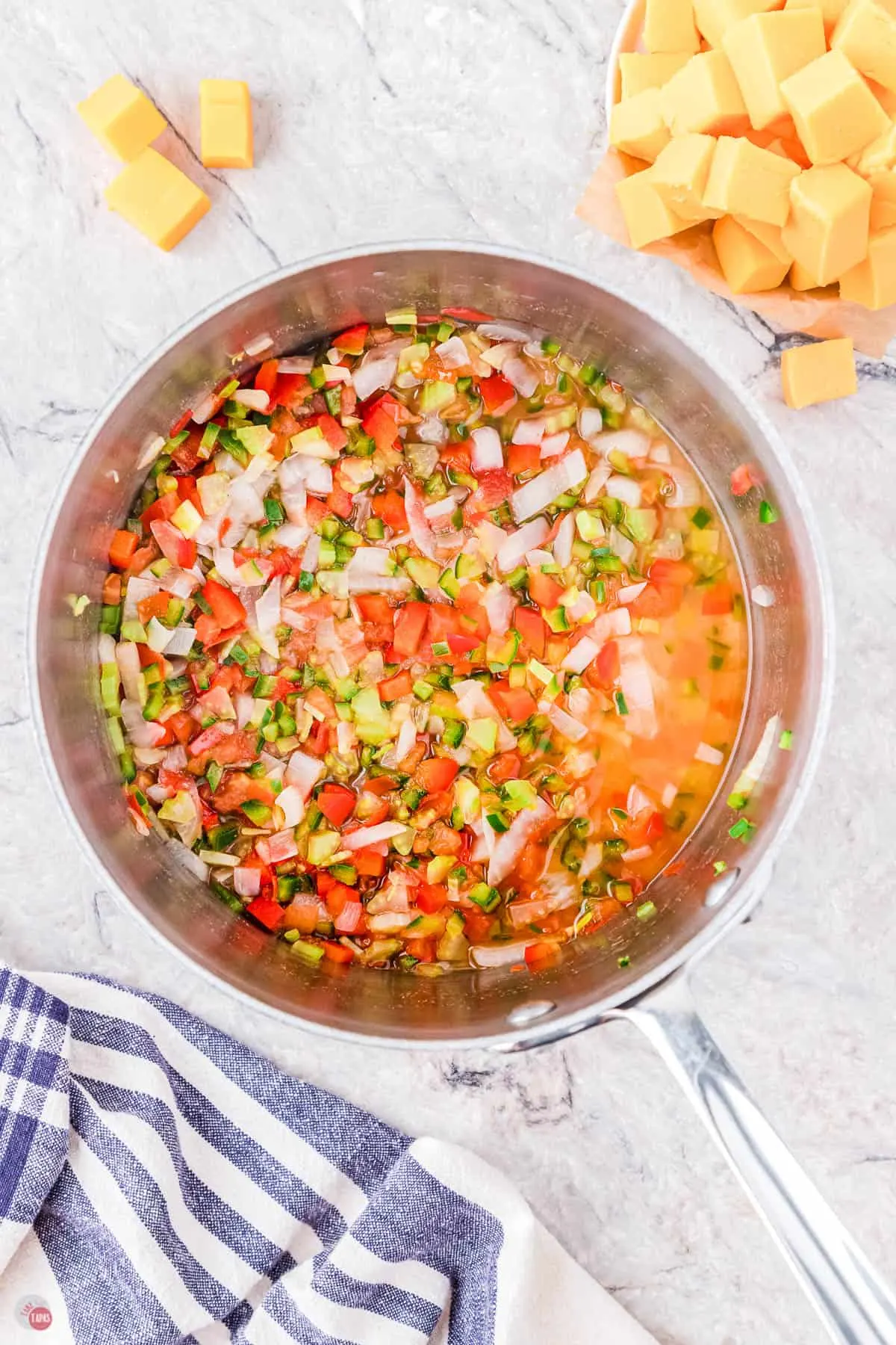 onion, tomato, celery cooking in a pot