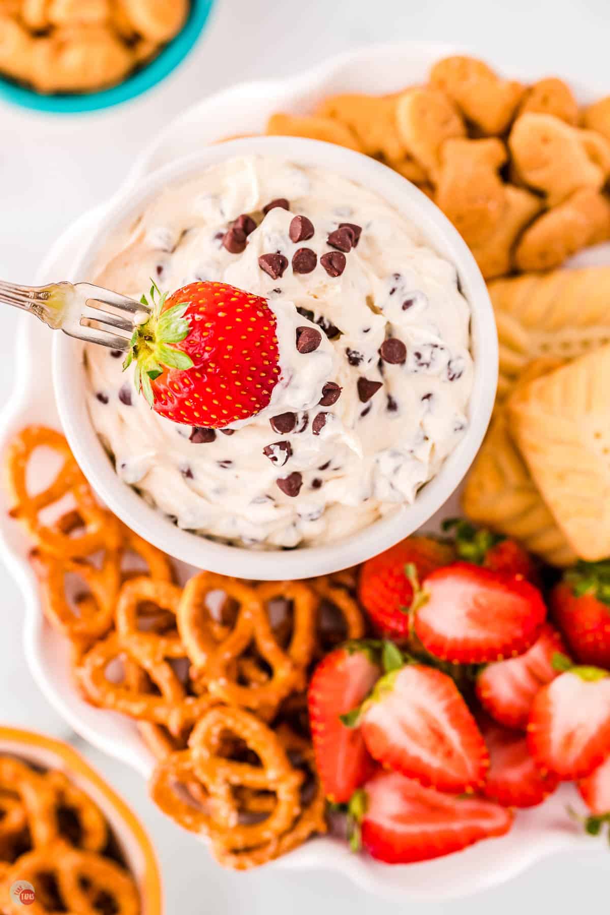 fork holding a strawberry being dipped in Booty dip