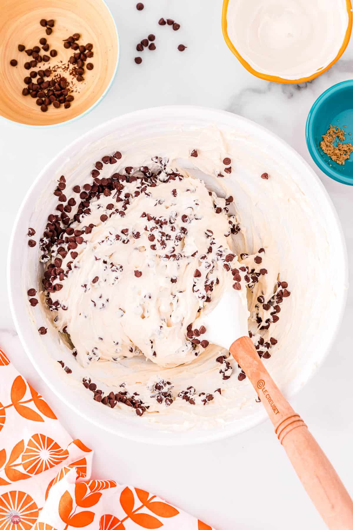 white bowl with dip and spatula folding in mii chocolate chips