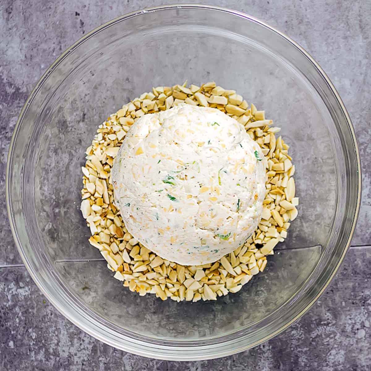 cheese ball in bowl of nuts