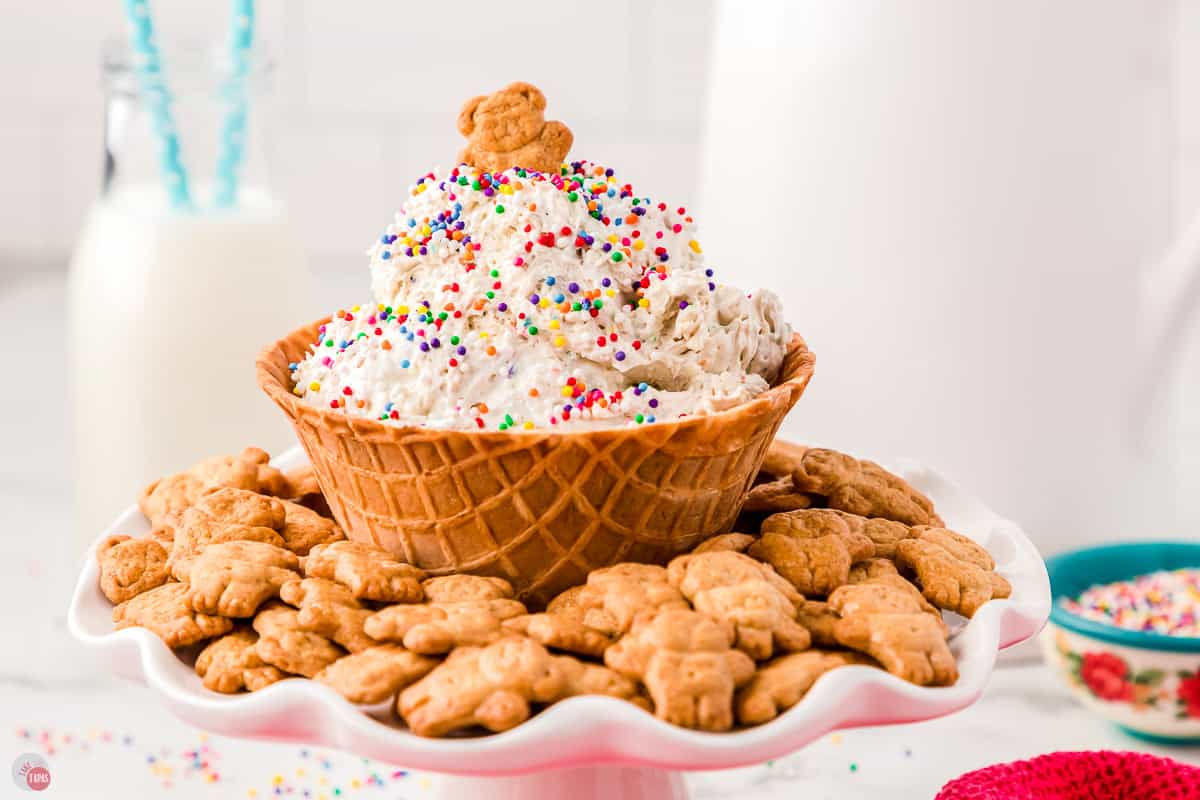 waffle bowl full of funfetti dip with teddy grahams