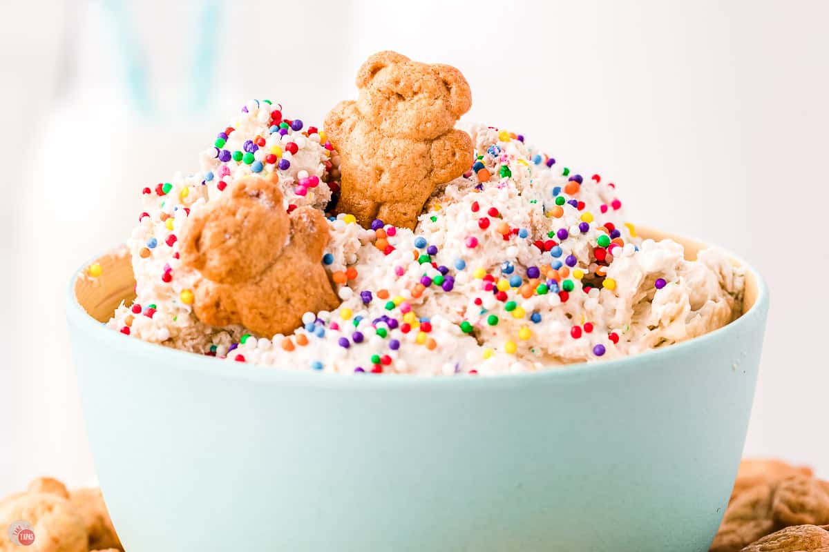 blue bowl of cake batter dip and sprinkles