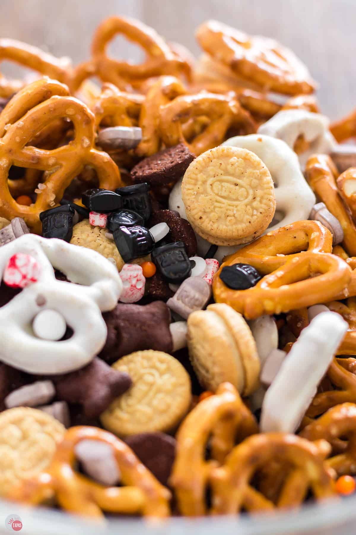 spooky halloween snack mix in a clear bowl