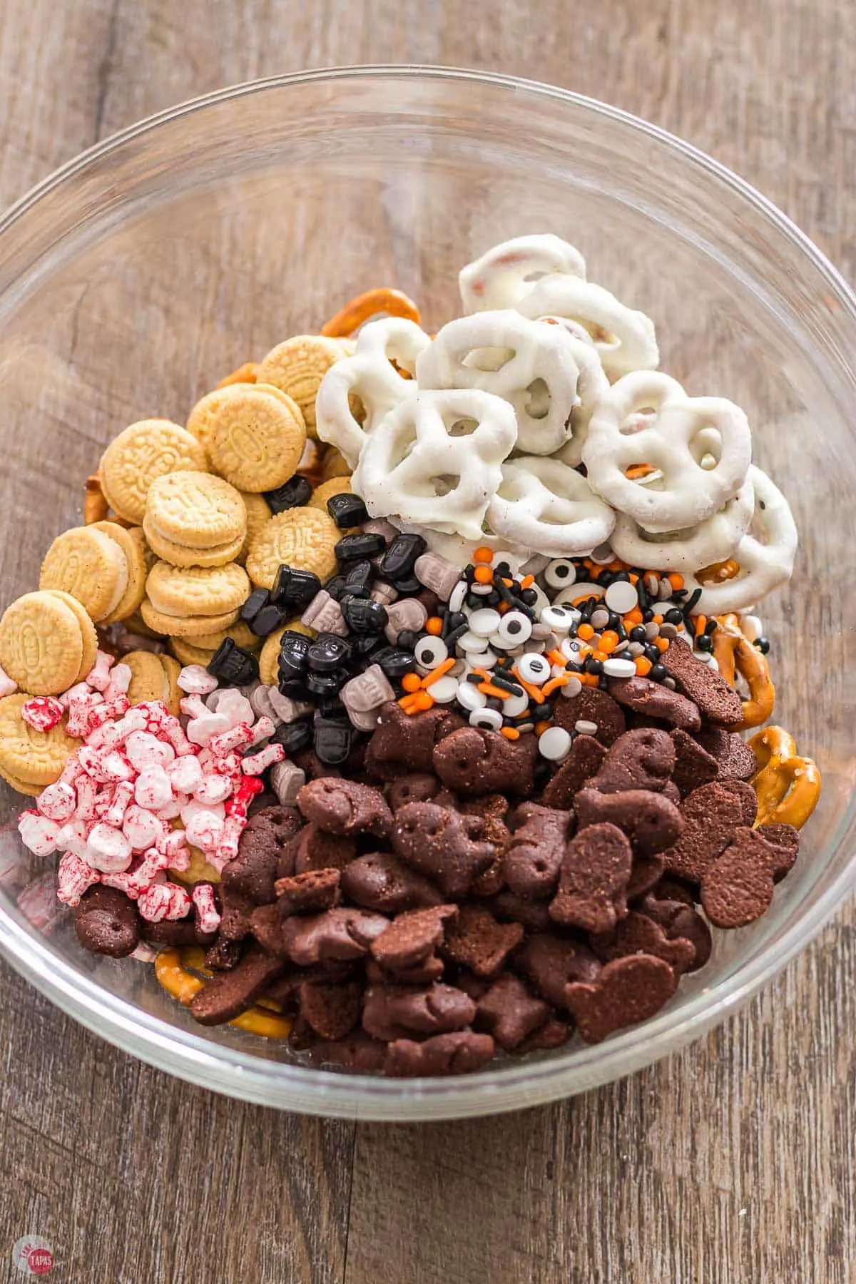 unmixed snacks in a clear bowl