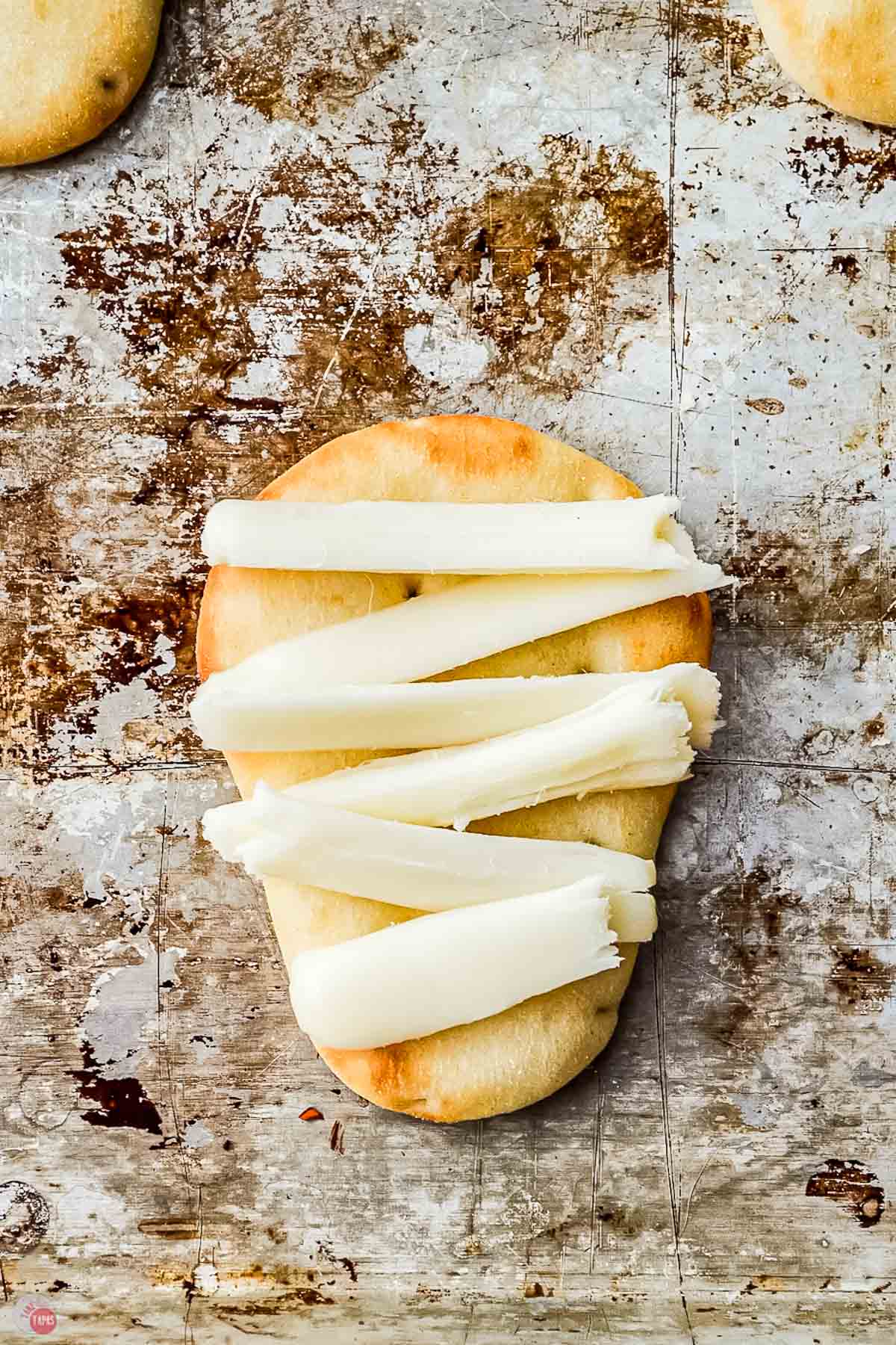 slices of cheese on naan dippers