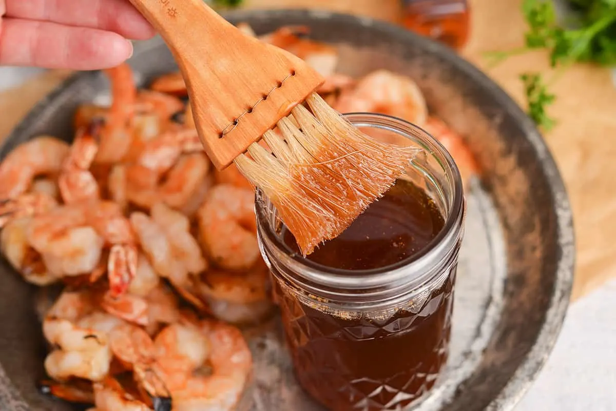 whiskey glaze in a jar and a brush