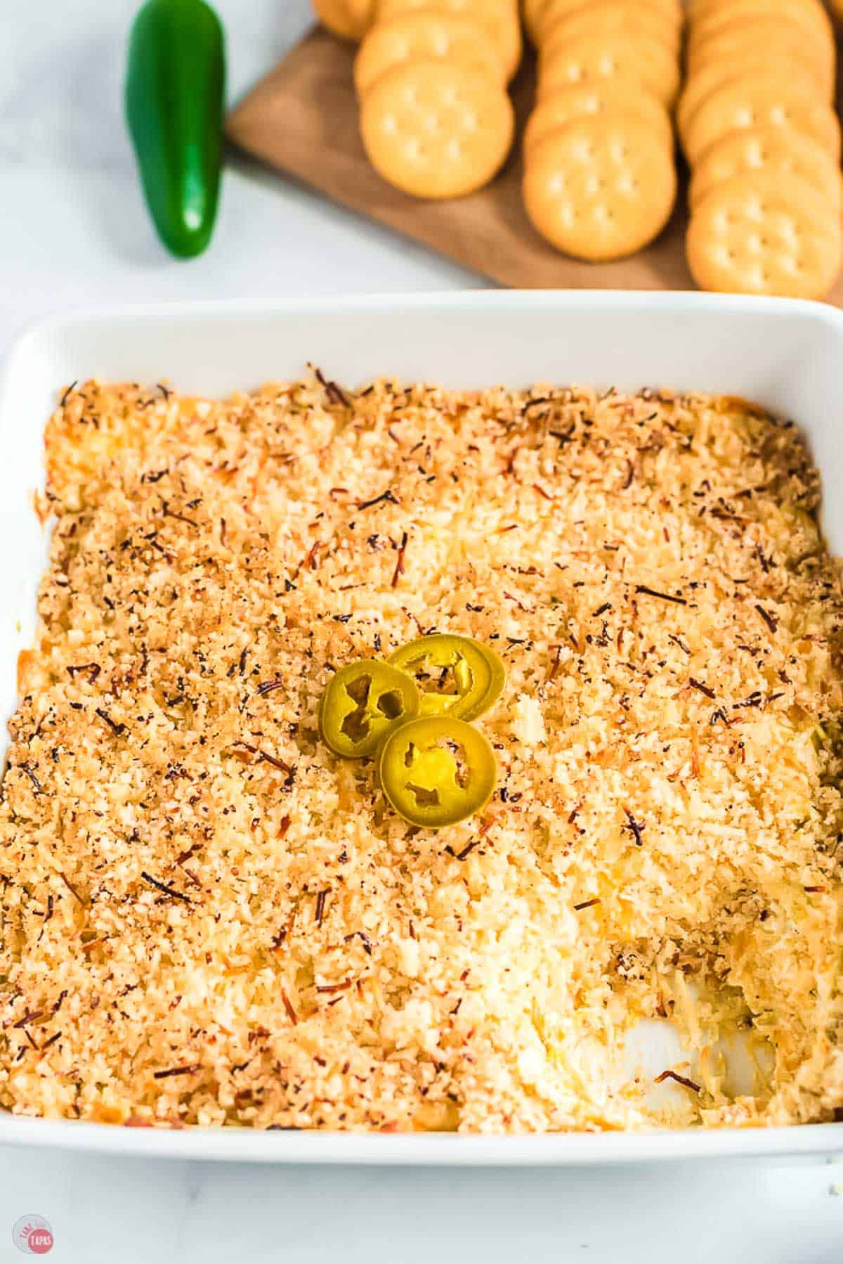 close up of popper dip with a scoop missing