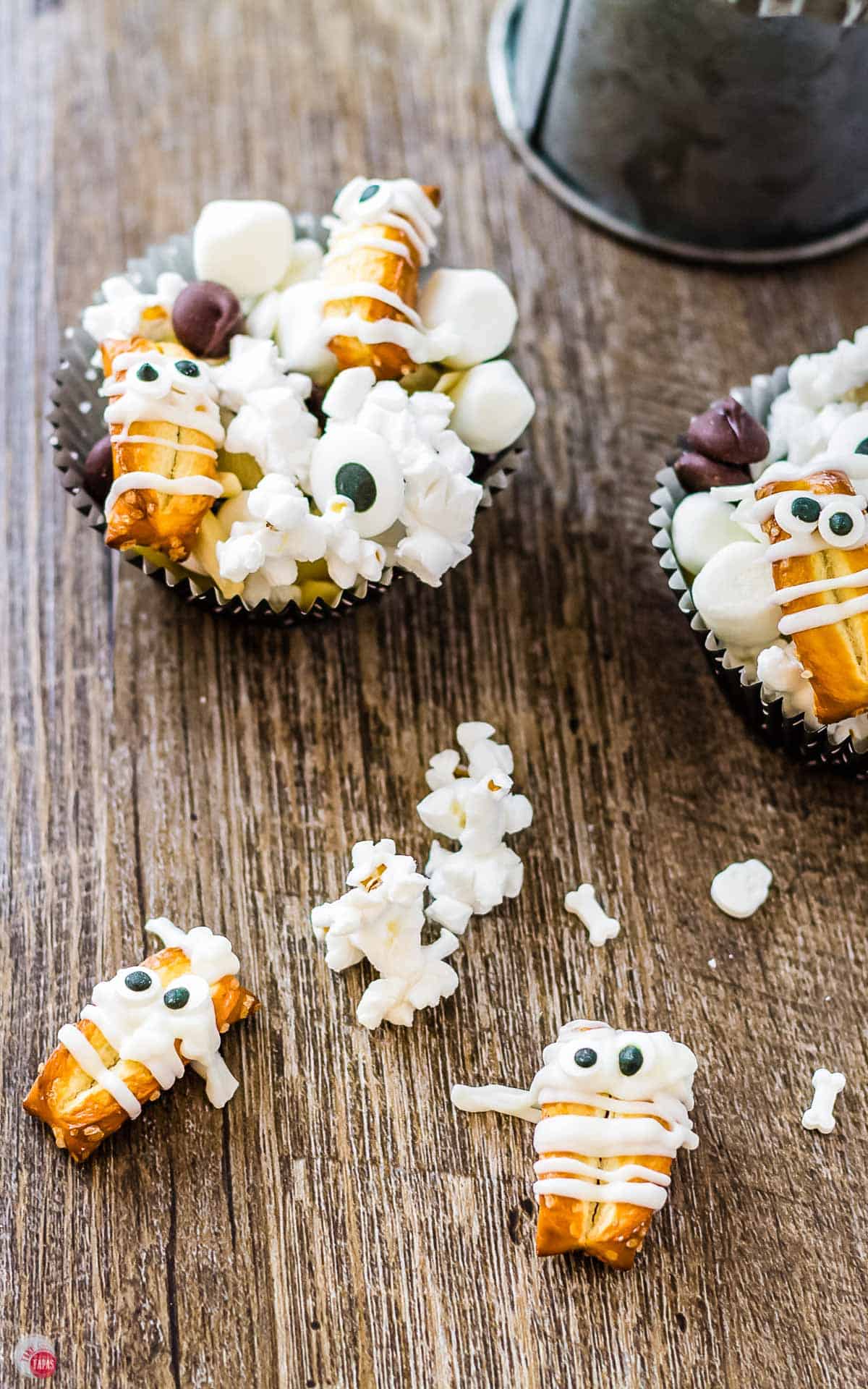 overhead views of muffin liners filled with mummy munch