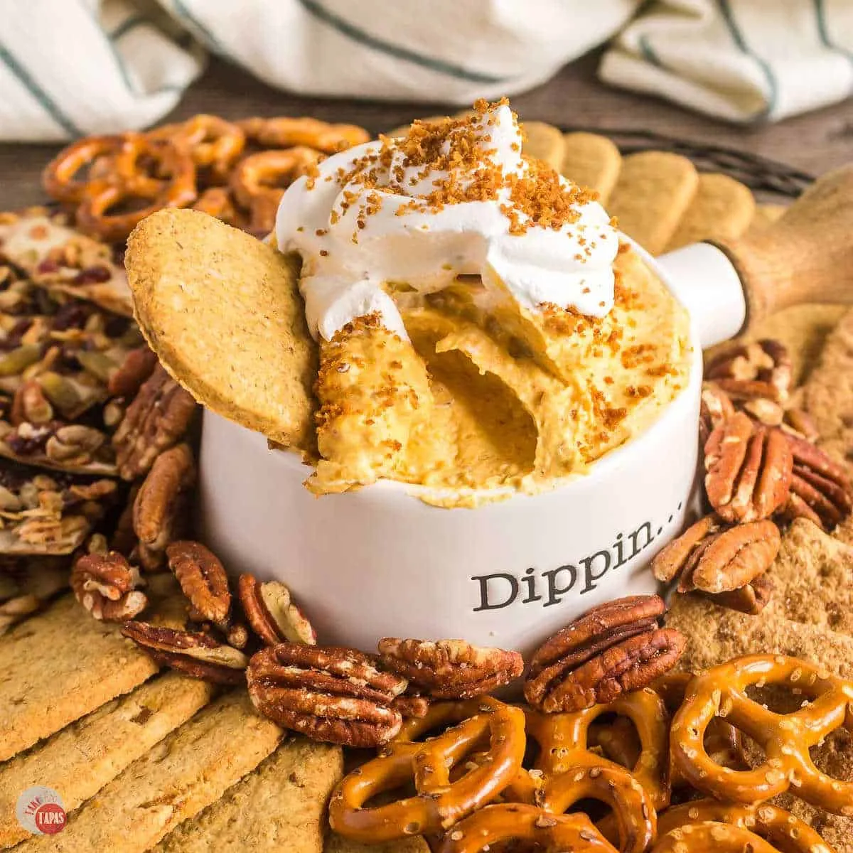 bowl of pumpkin dip with pretzels