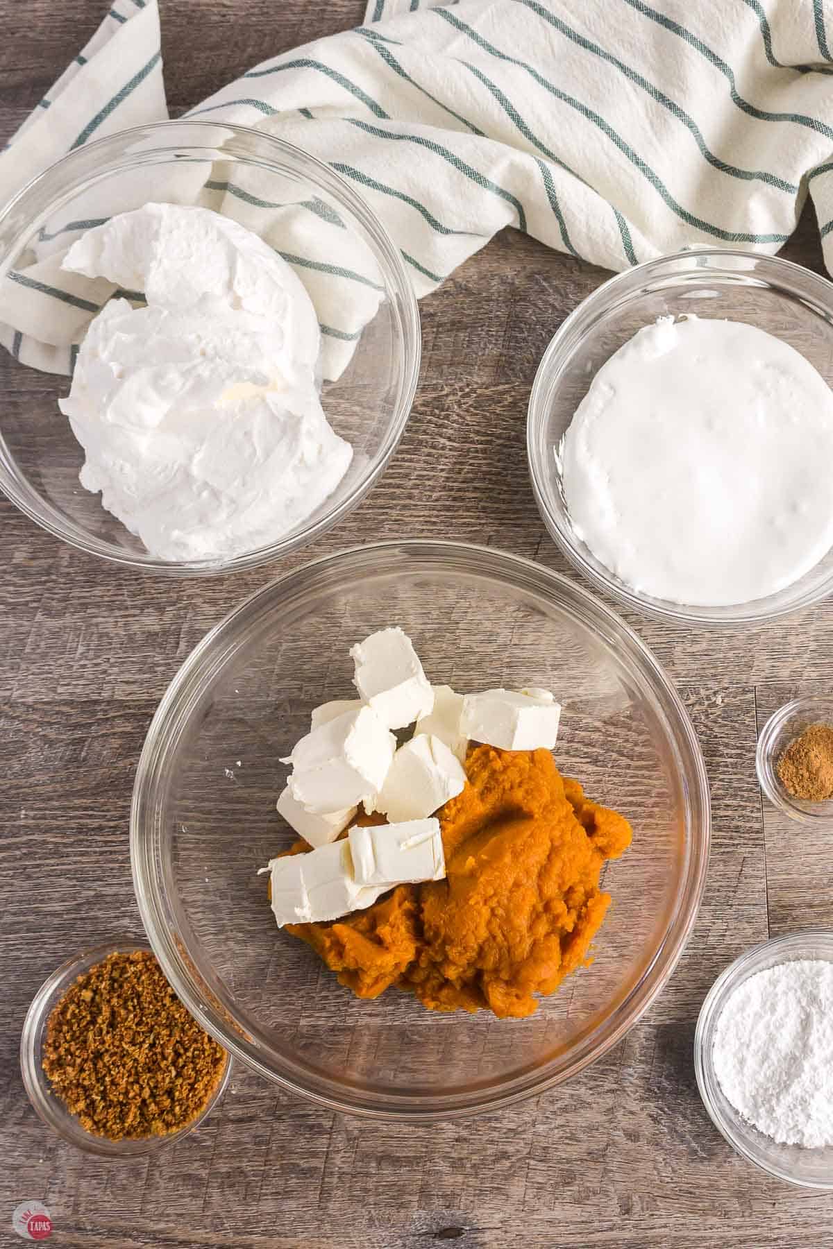 cream cheese and pumpkin in a clear bowl