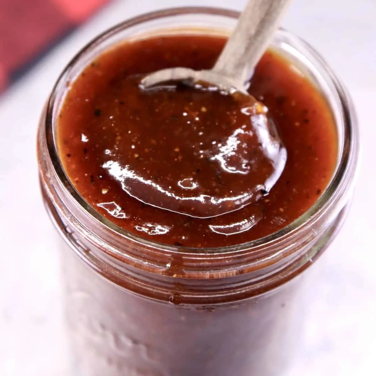 sweet and tangy bbq sauce in a small mason jar