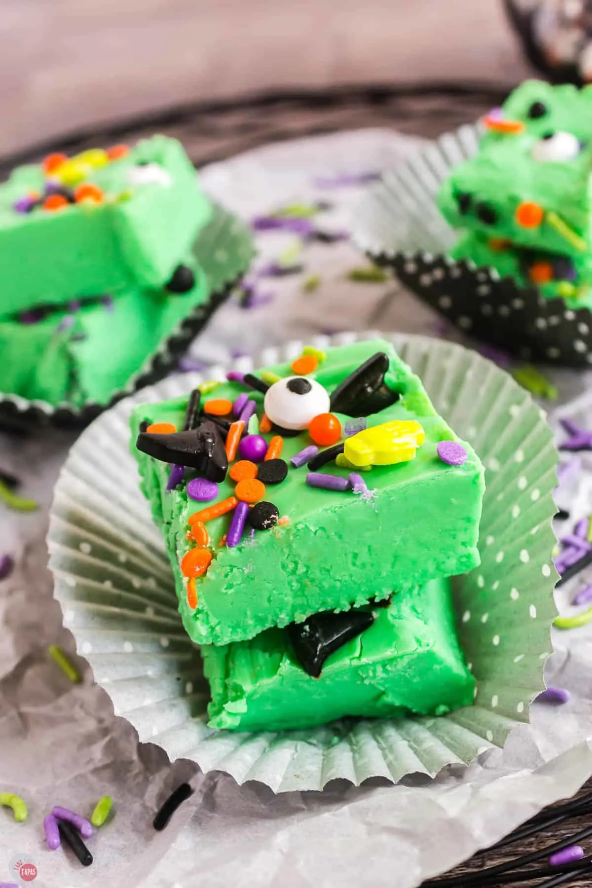 stack of green fudge in a cupcake wrapper