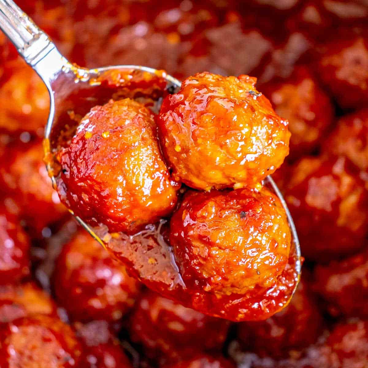 spoon of three meatballs in sauce