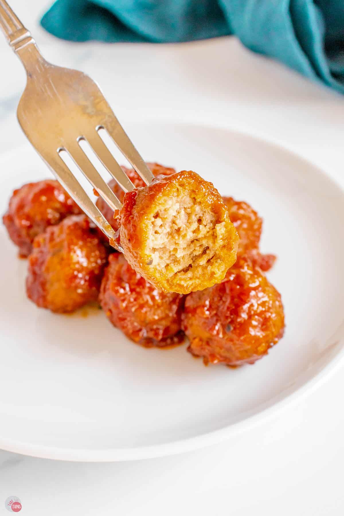 meatball on a fork with a bite missing