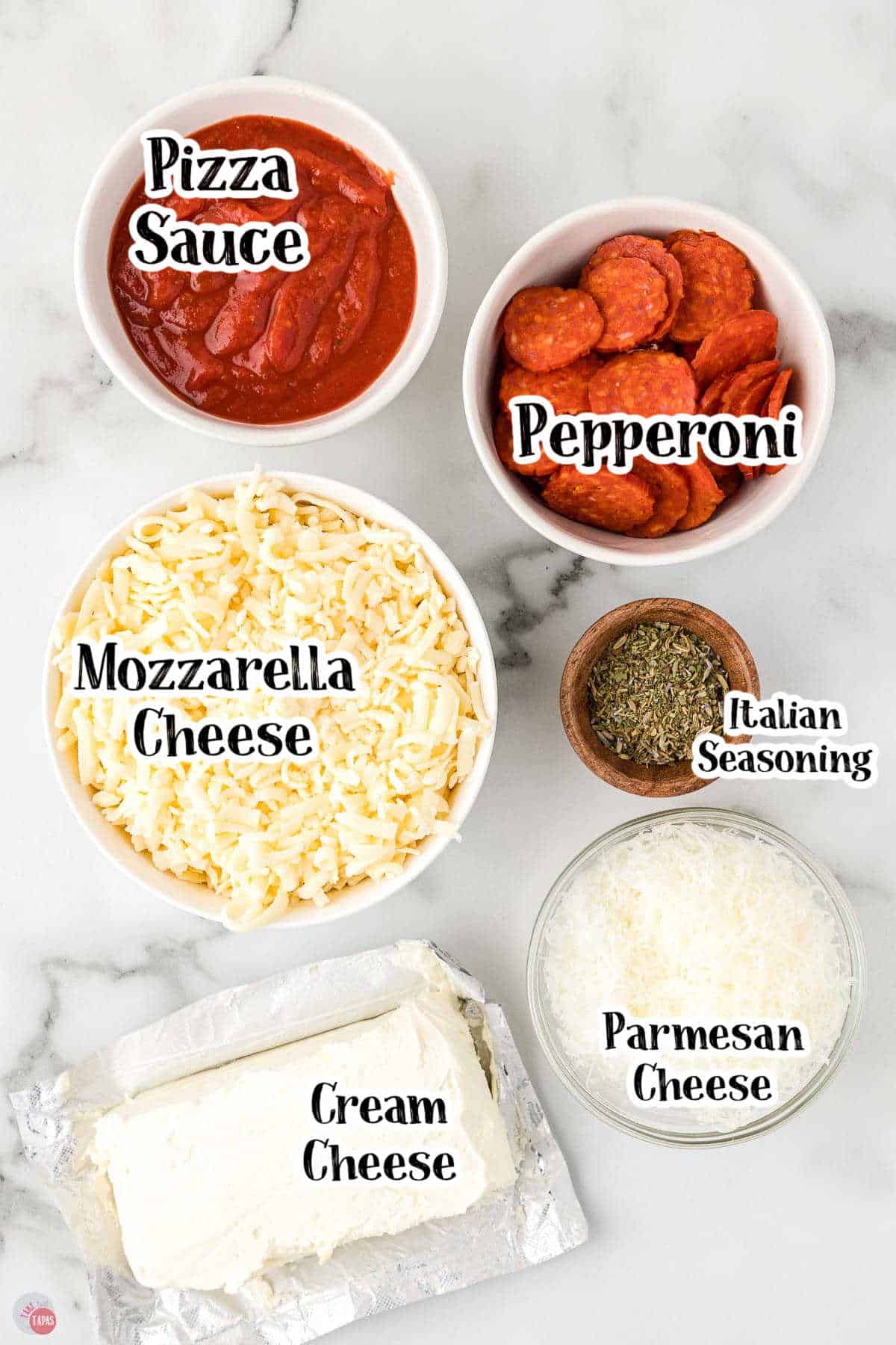 labeled picture of pizza dip ingredients in individual bowls