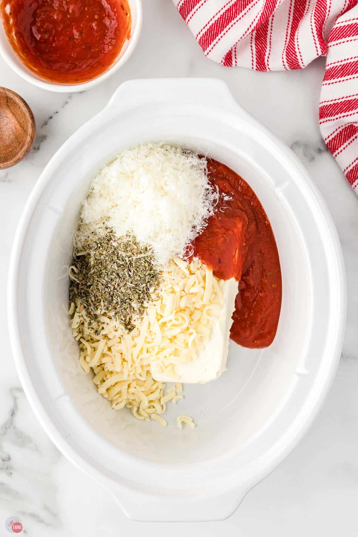 dip ingredients in a white crock pot bowl