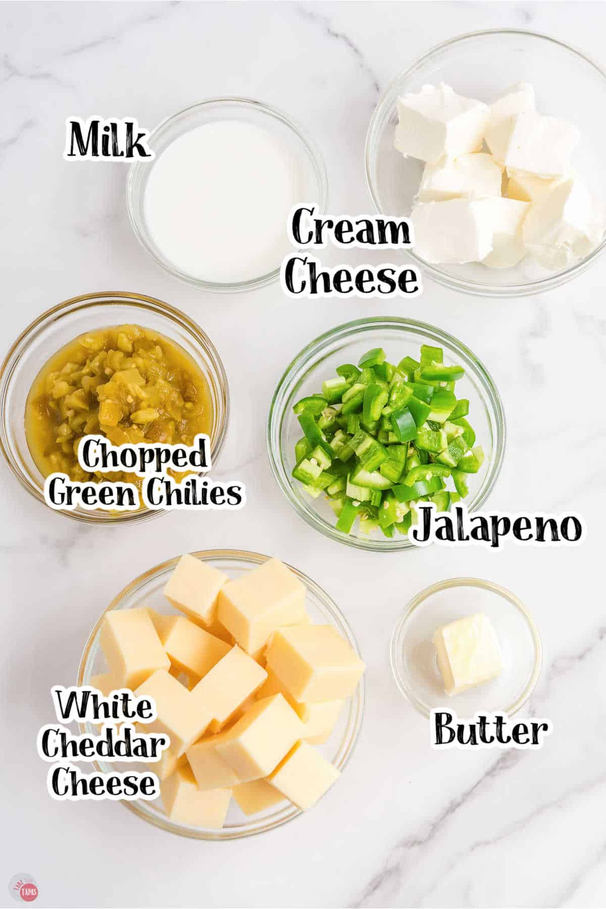labeled picture of cheese dip ingredients in clear bowls
