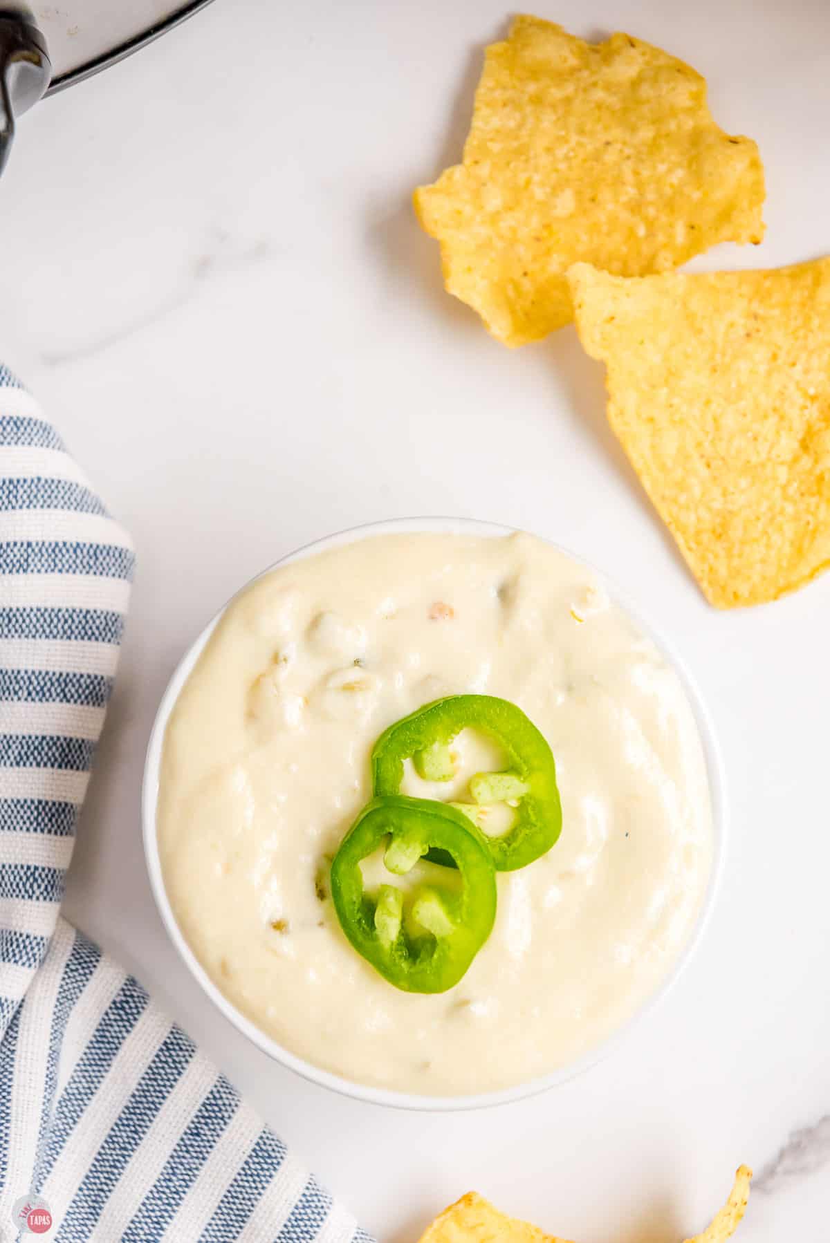 small bowl of cheese dip with fresh sliced peppers