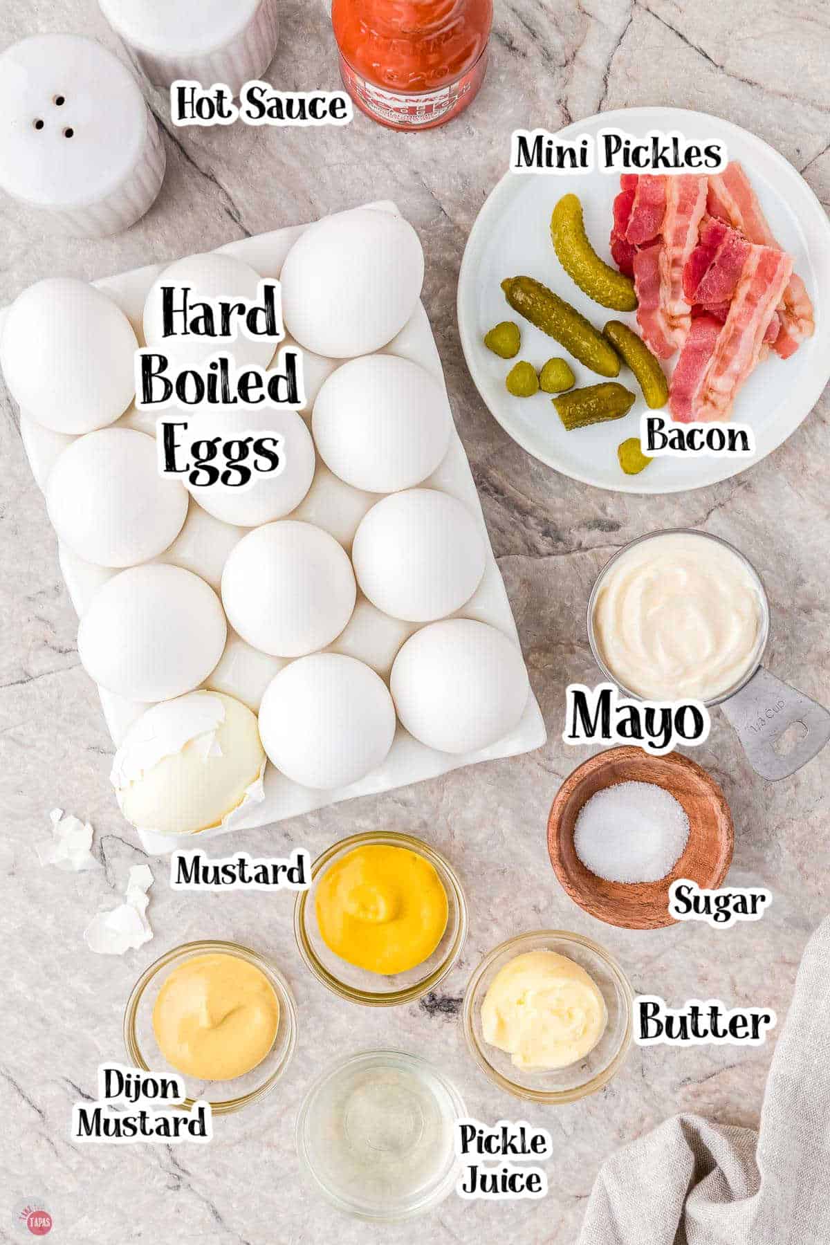 labeled picture of deviled egg ingredients in individual bowls