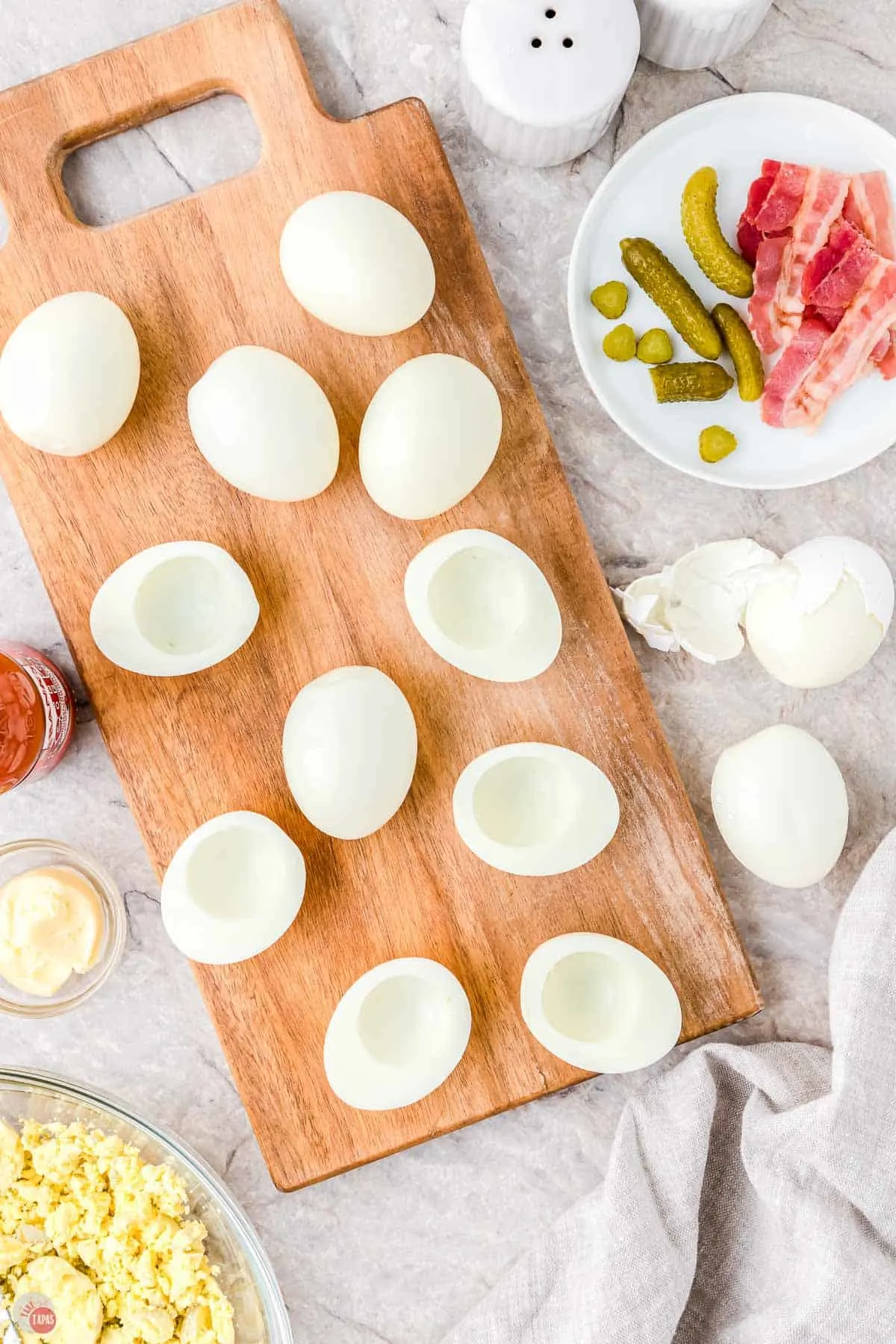 egg white halves on a wood board