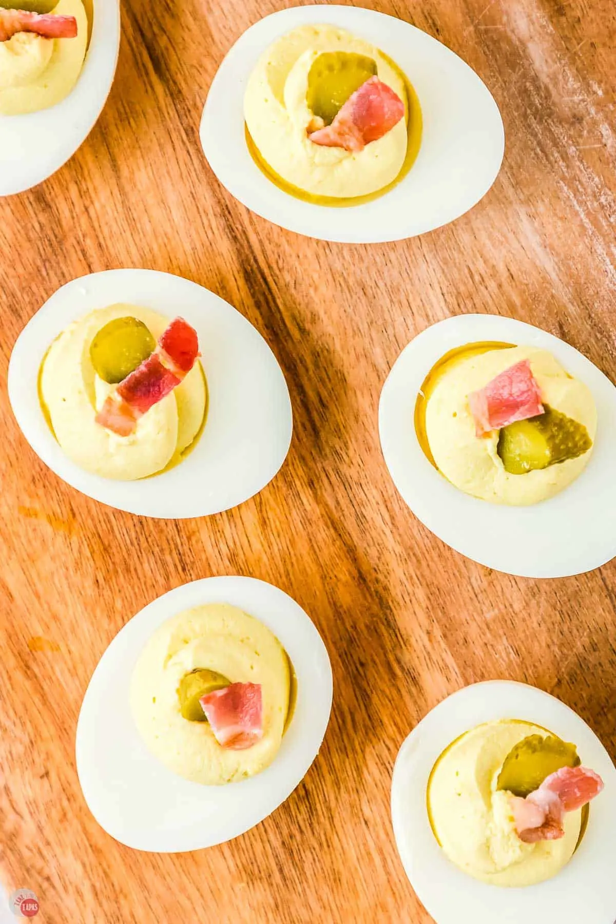 deviled eggs on a wood plank