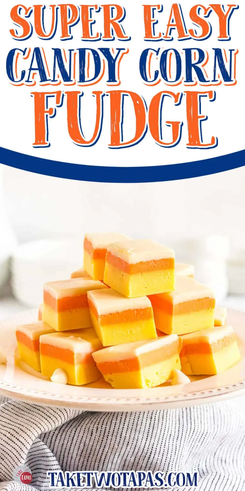 stack of candy corn fudge on a white platter with a white banner with text
