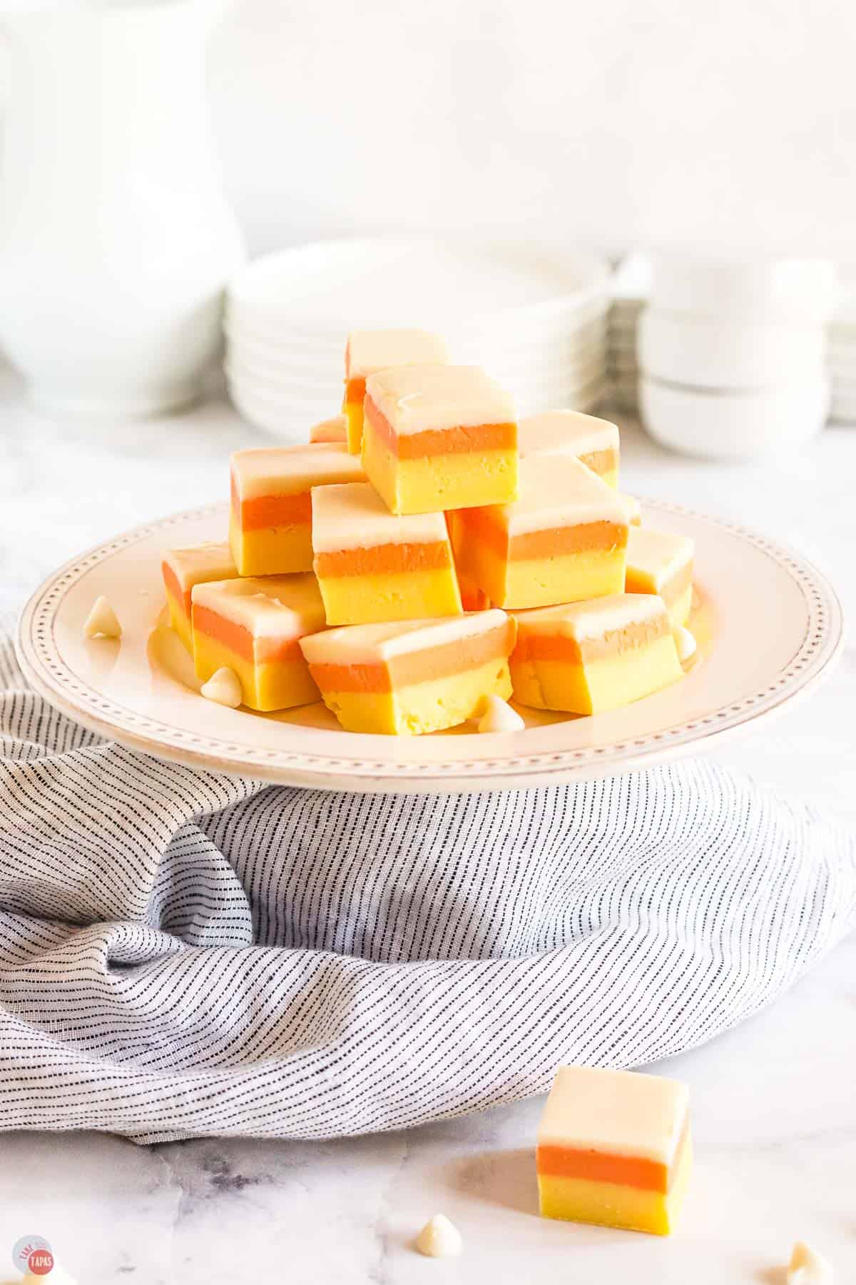 cake plate topped with layered colored fudge