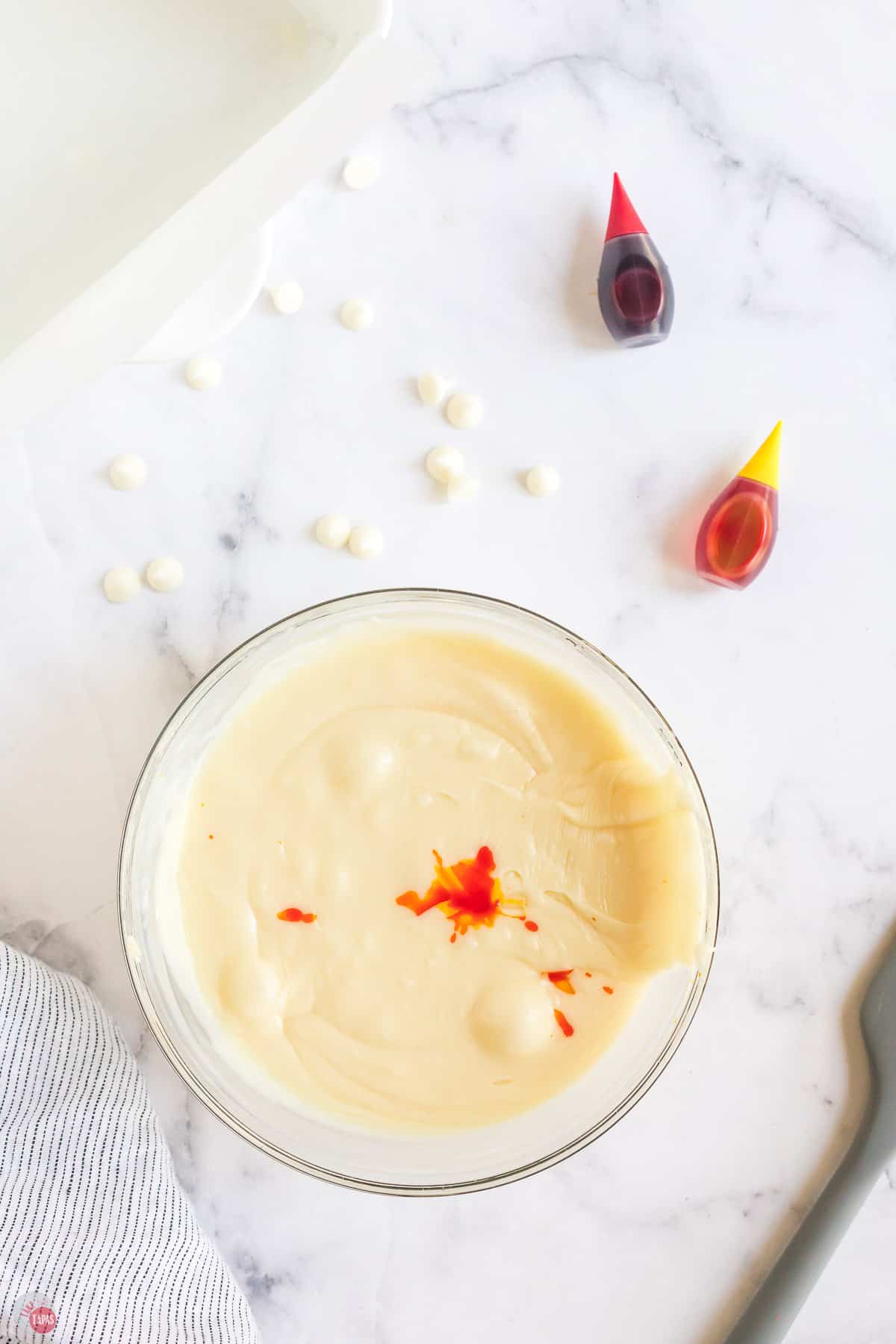 bowl of melted chocolate with food coloring in it