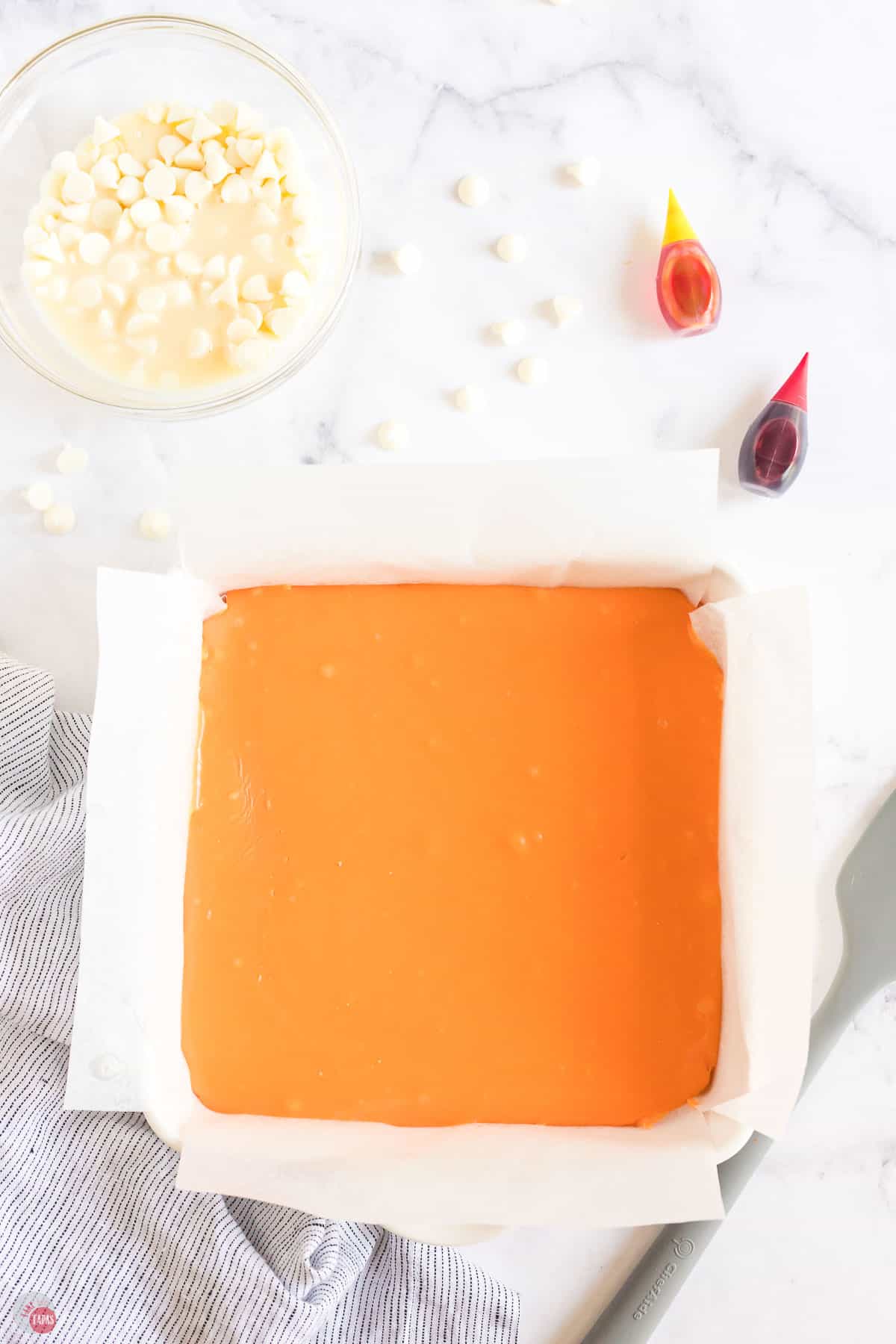 orange fudge in a square pan
