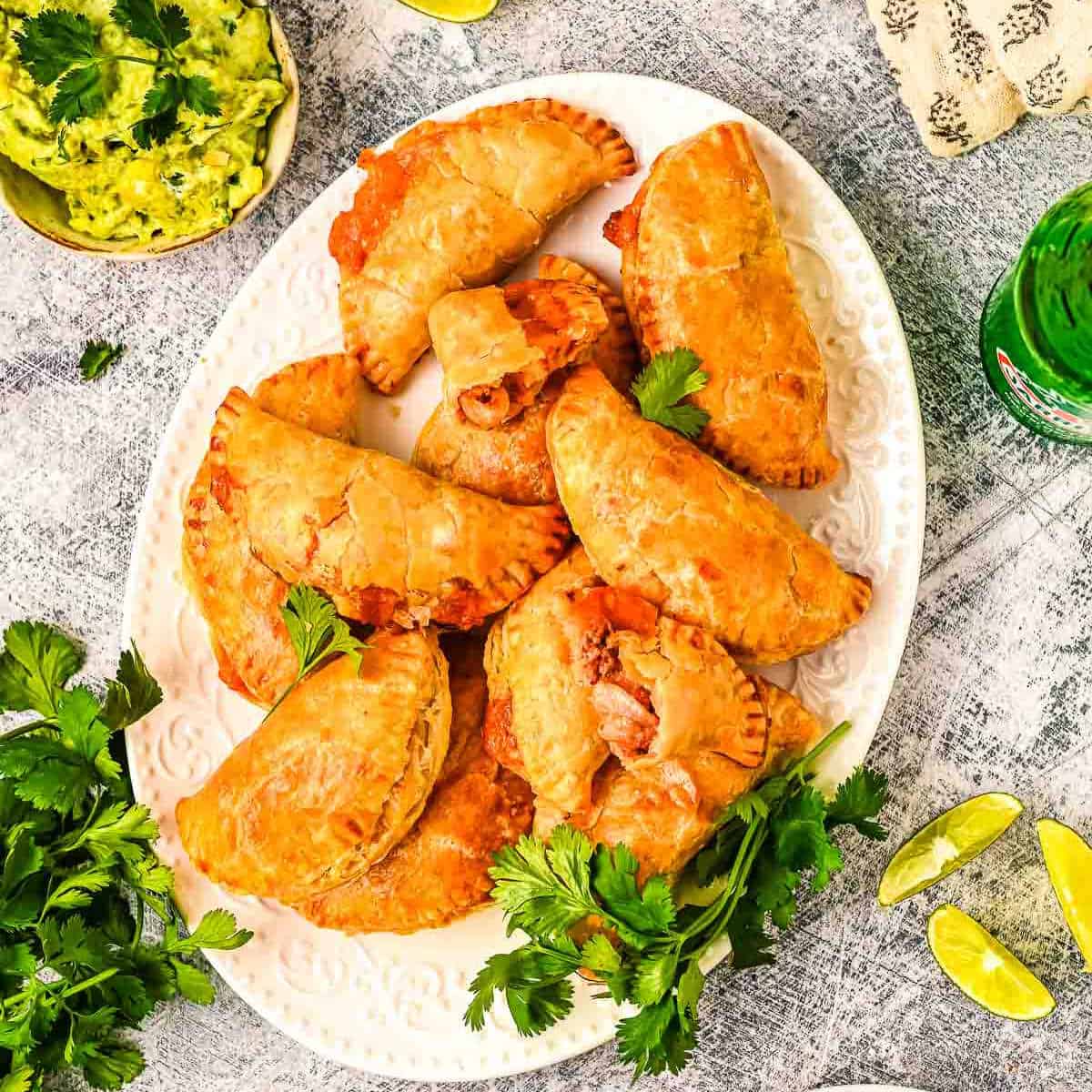 overhead picture of plate of empanadas with cilantro