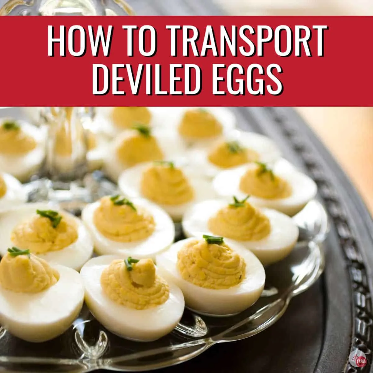 clear tray of deviled eggs with red banner and text