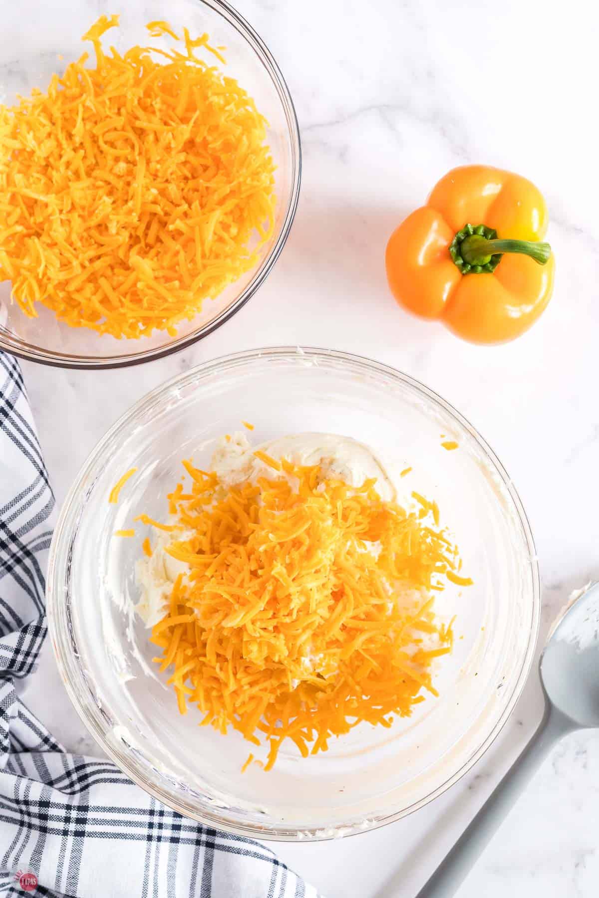 shredded cheddar cheese in a bowl