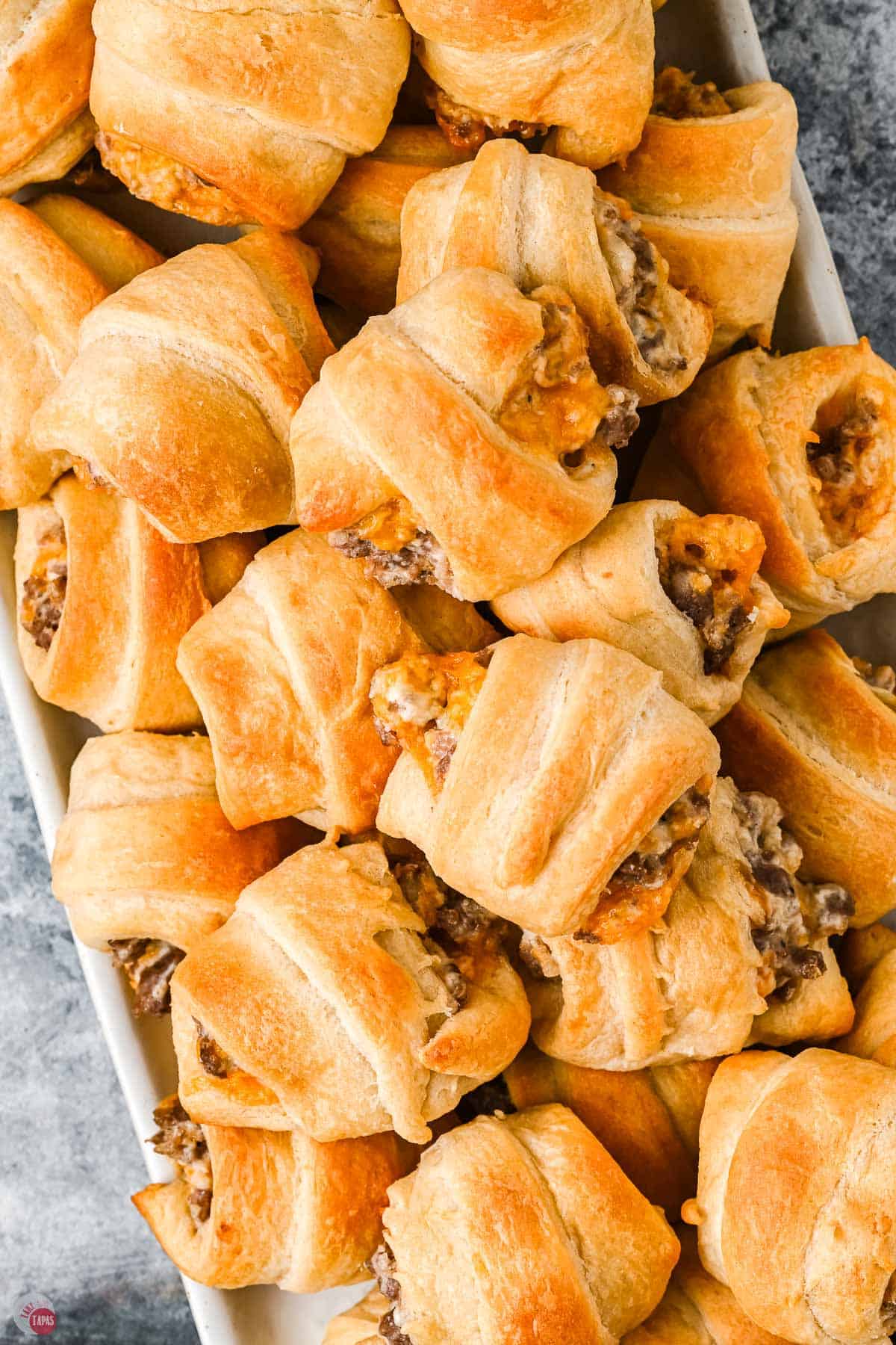 overhead tray of crescent rolls with sausage