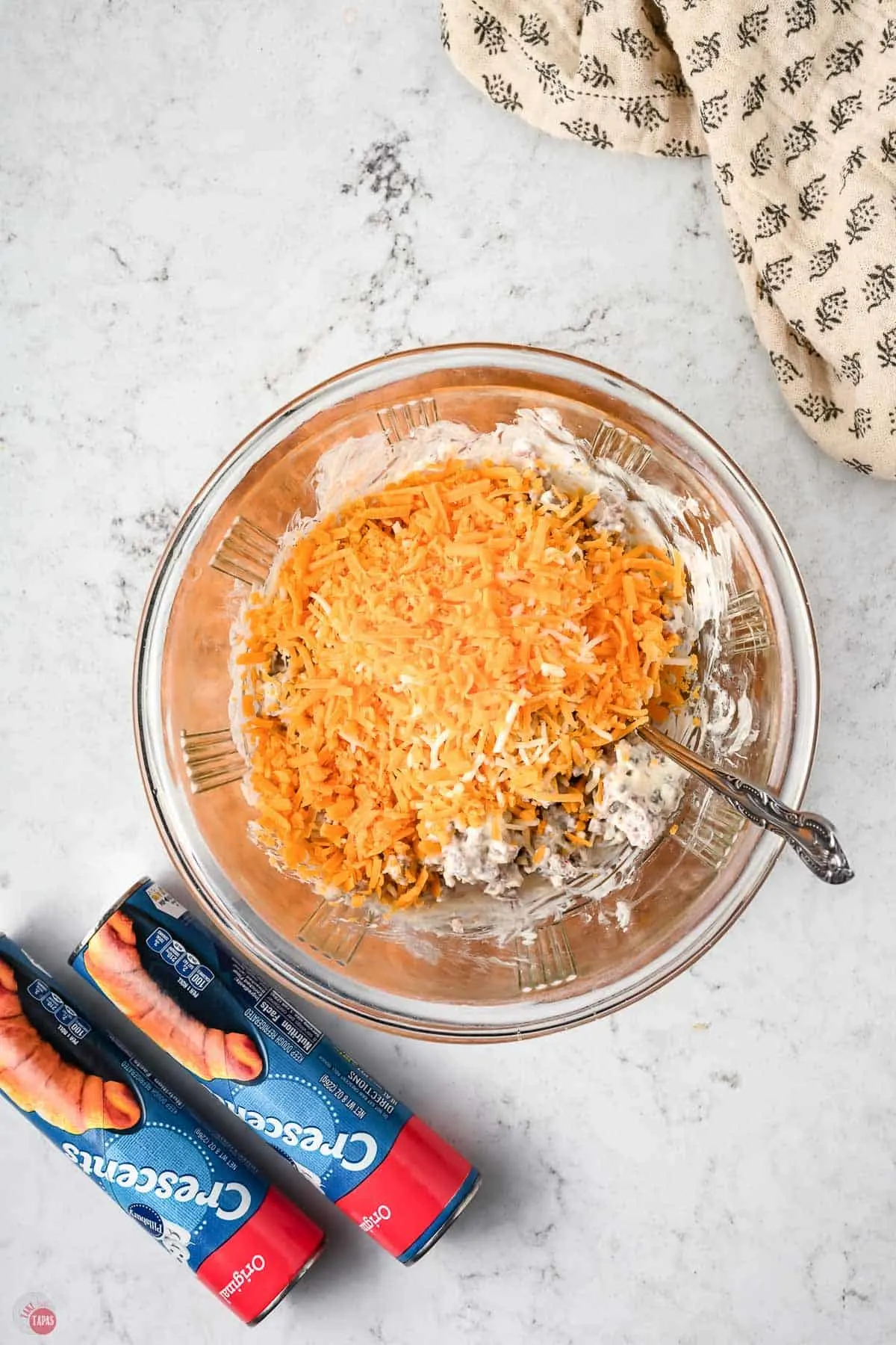 sausage, cream cheese, and cheddar cheese in a bowl