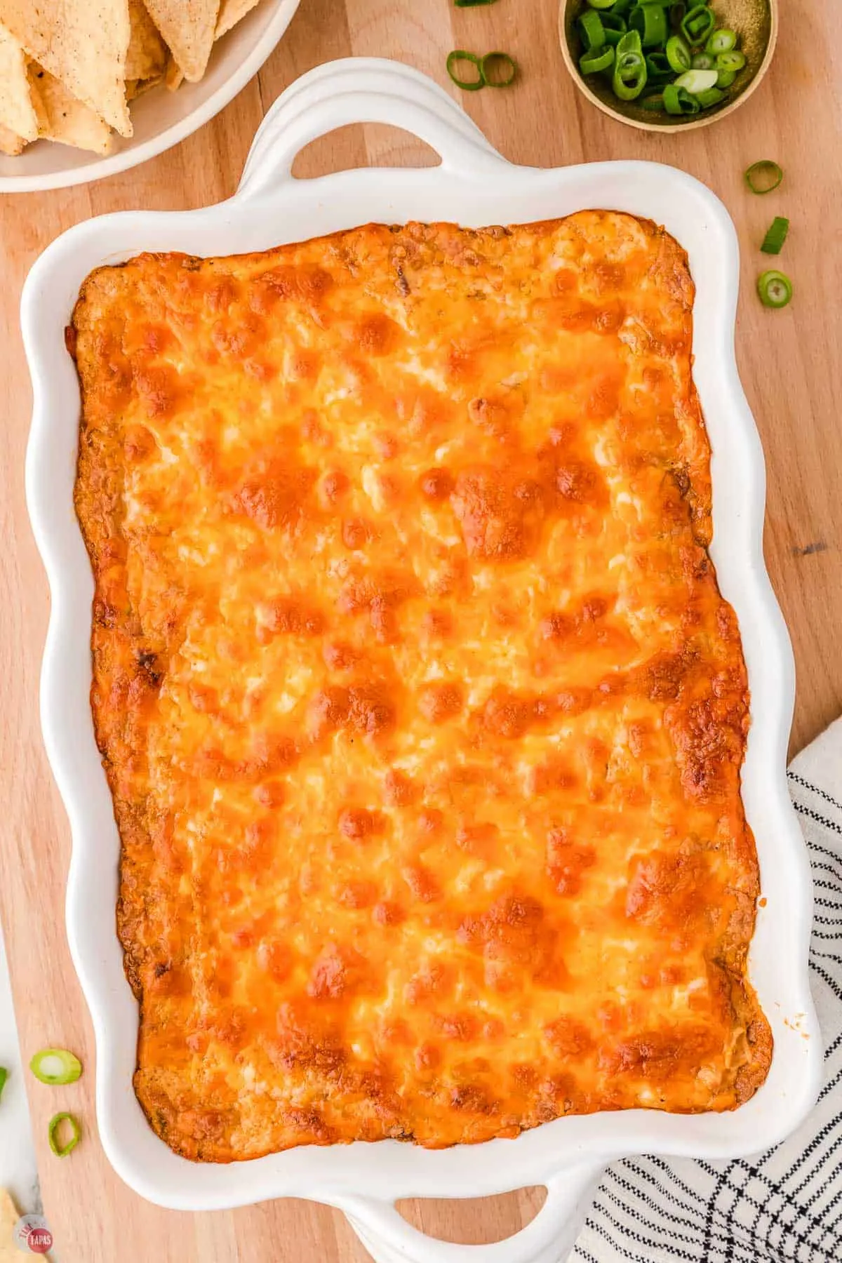 baked Texas trash dip in a white rectangle dish