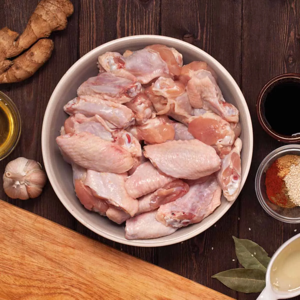 bowl of chicken wings that are uncooked