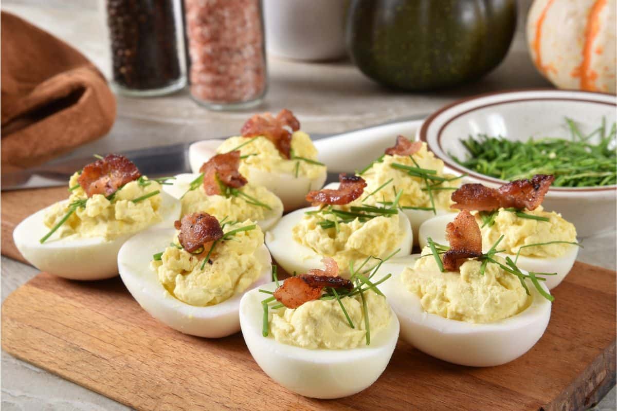 eggs with filling and topped with bacon