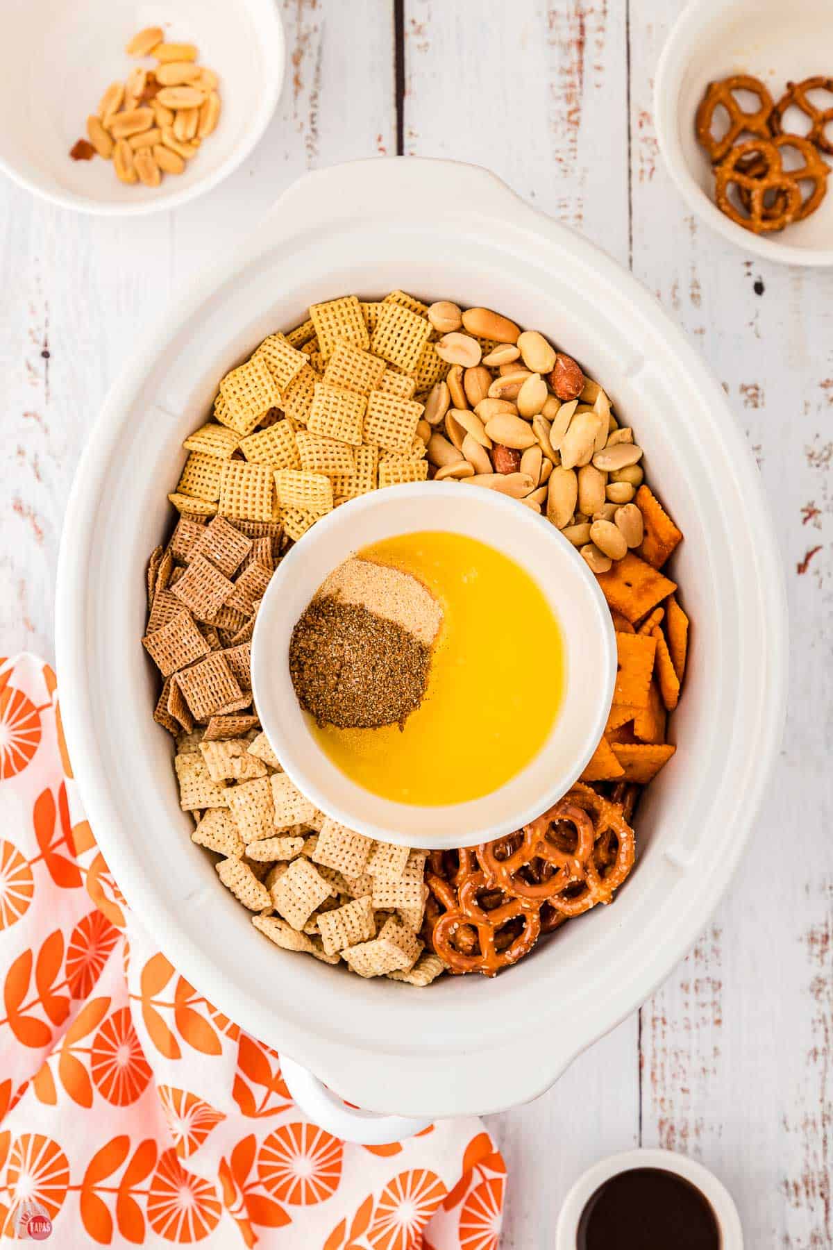 bowl of melted butter and spices in a crock pot