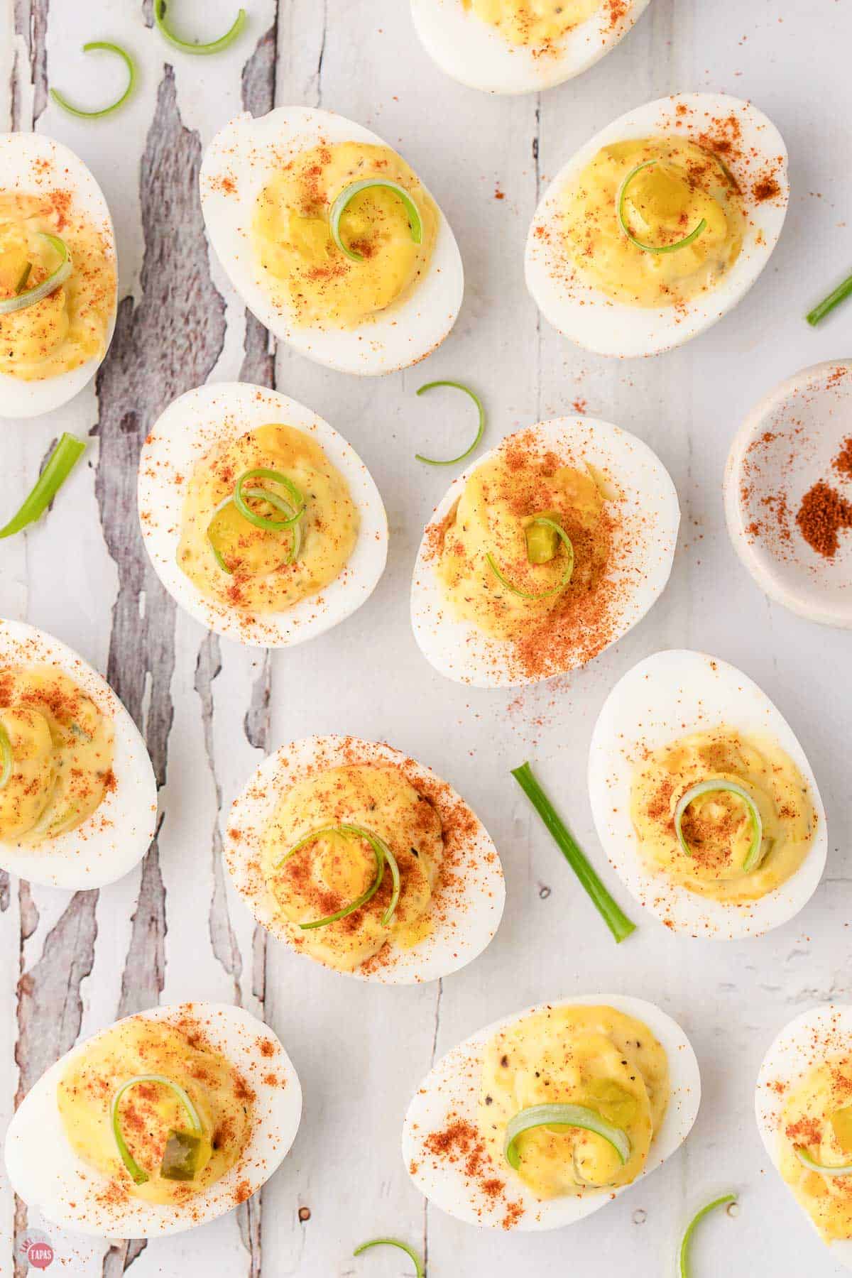 wood plank with deviled eggs on it