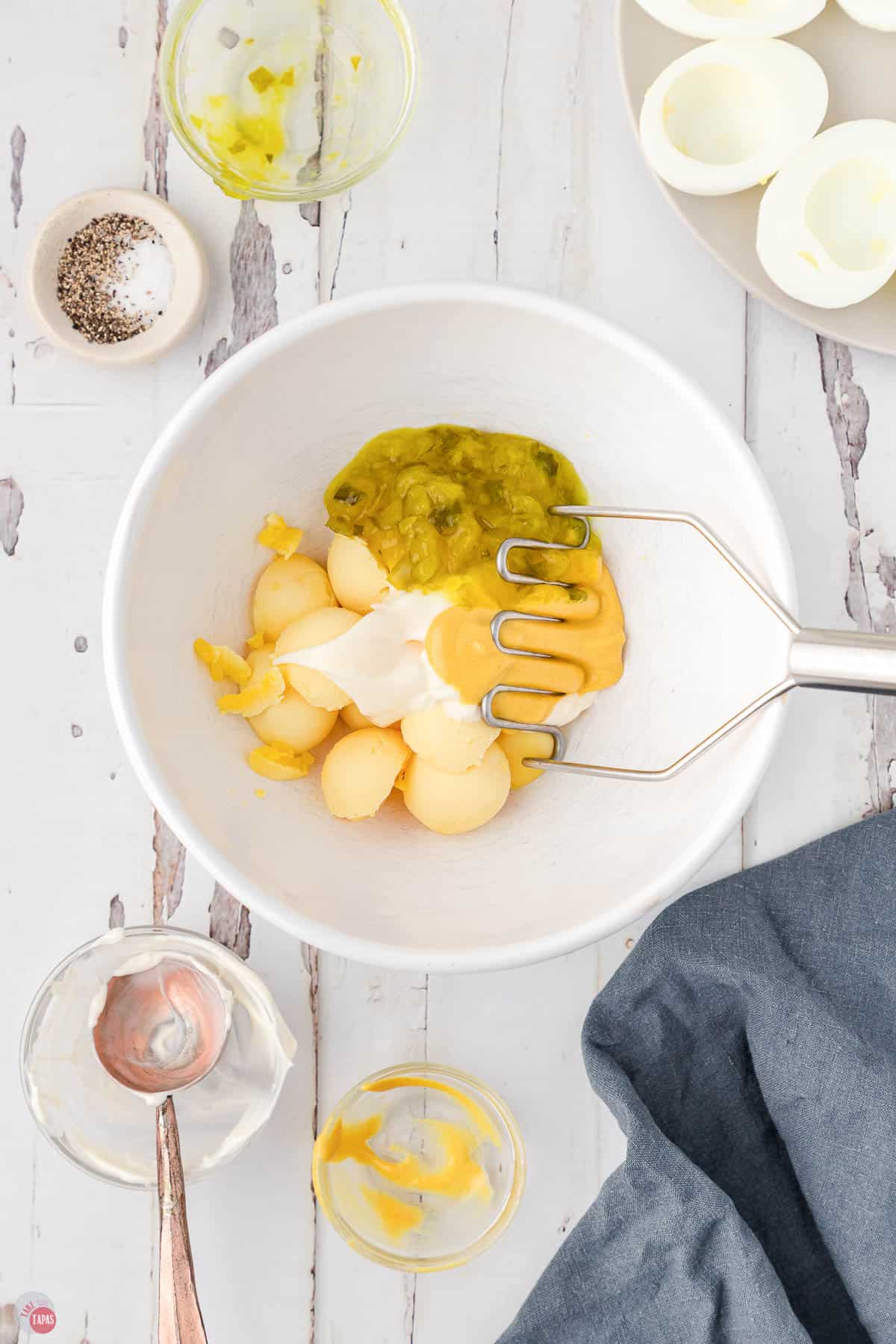 egg yolks, mayo, and relish in a bowl