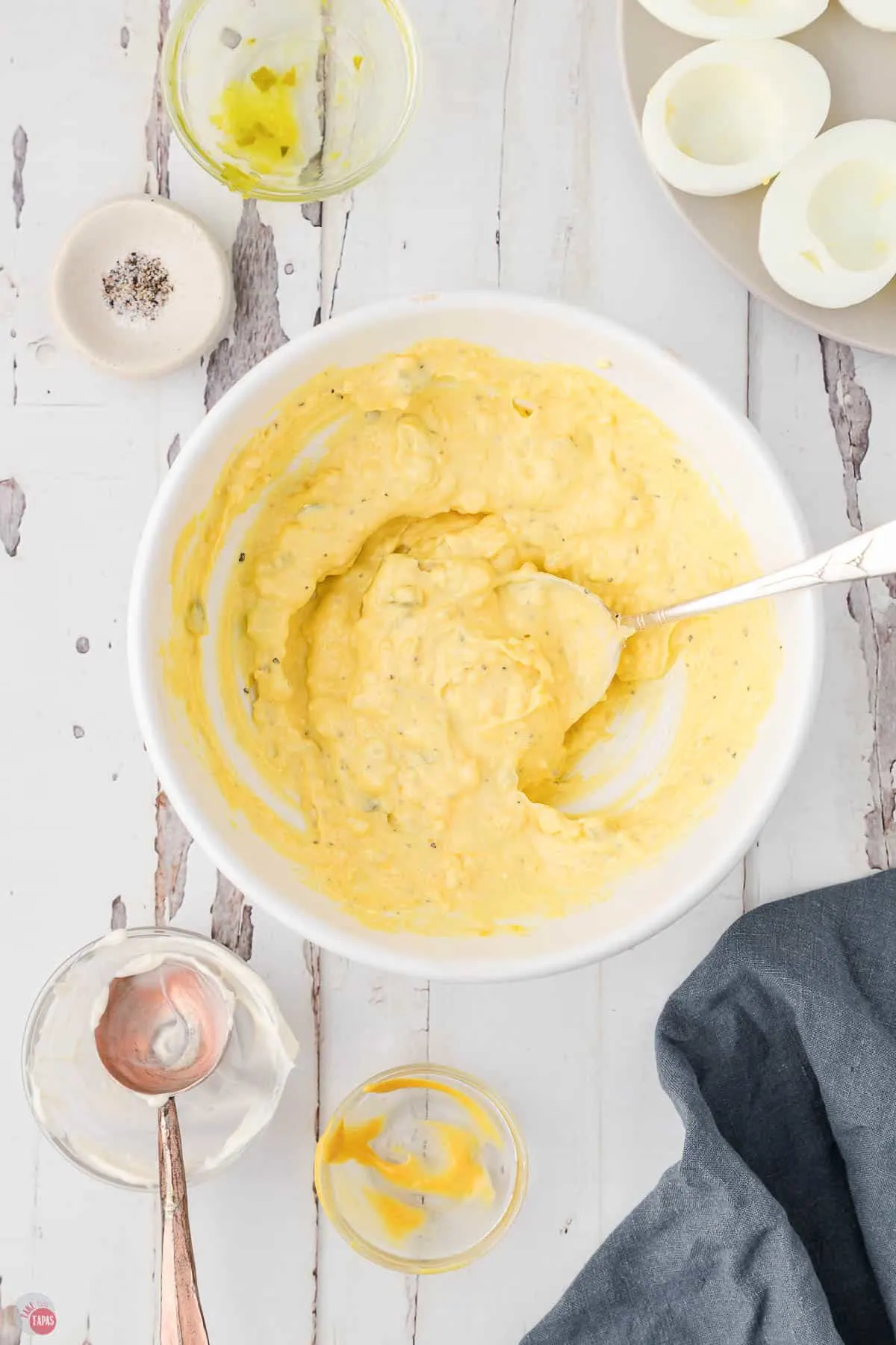 deviled egg filling in a white bowl