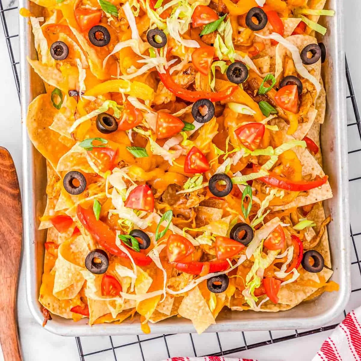 cookie sheet covered in shredded fajita nachos