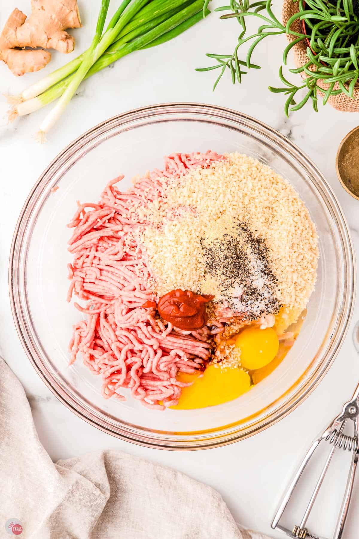 meatball mixture in a bowl before it's mixed