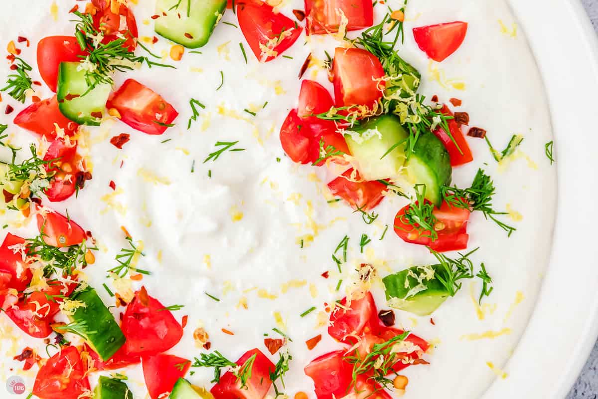 close up of Greek dip and tomatoes