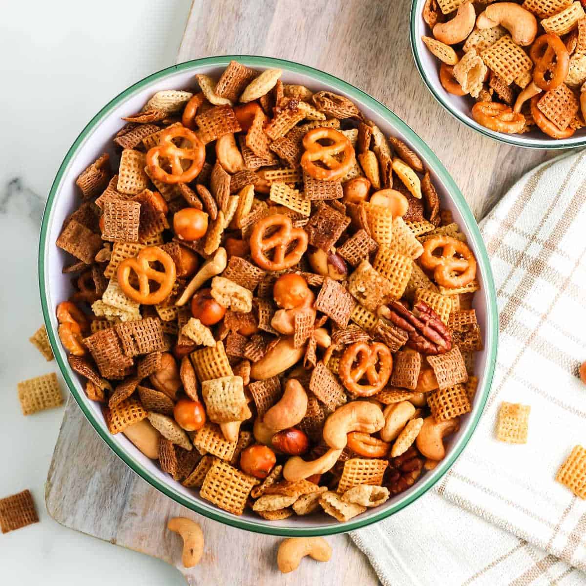 overhead bowl of party mix on a napkin