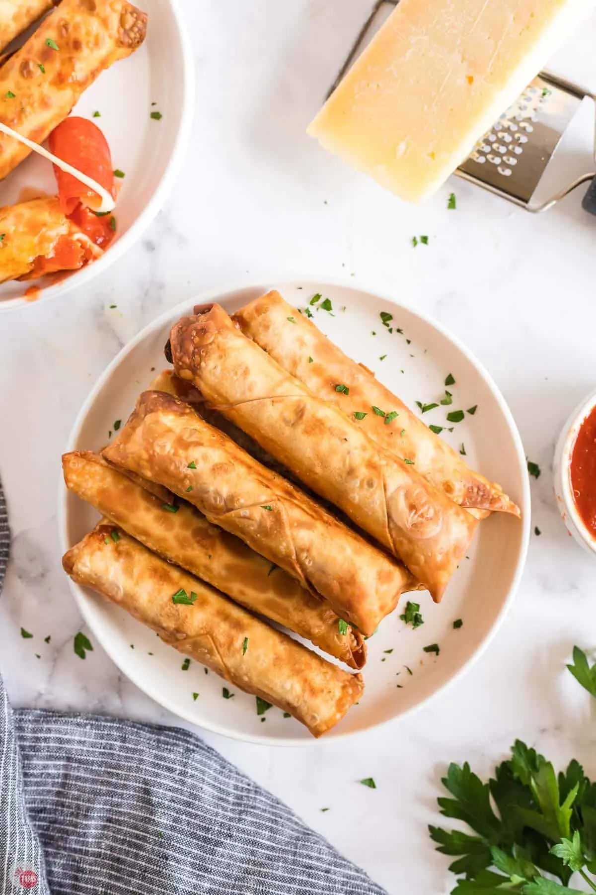 overhead picture of pizza egg rolls on a plate