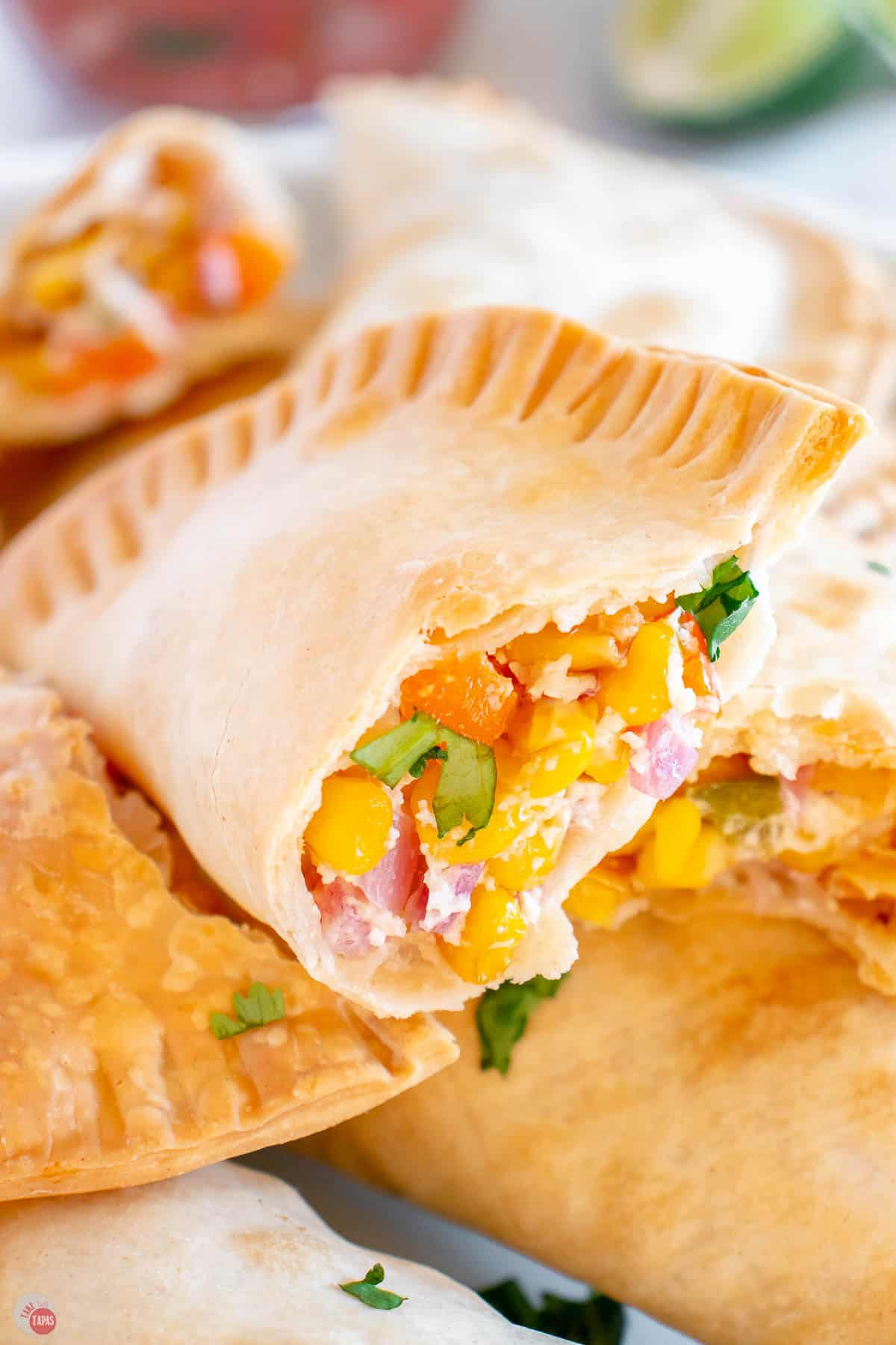 open corn empanada on a stack