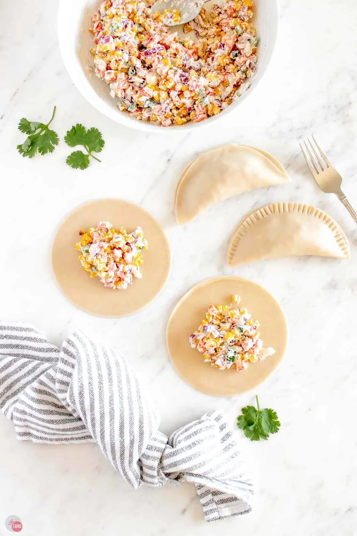 corn salad on empanada dough discs
